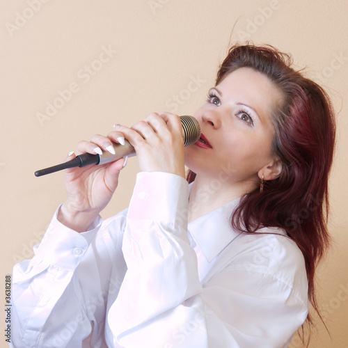 Girl singing in a microphone