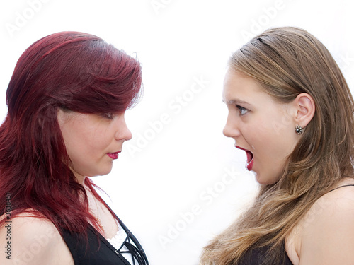 Two girls screaming to another