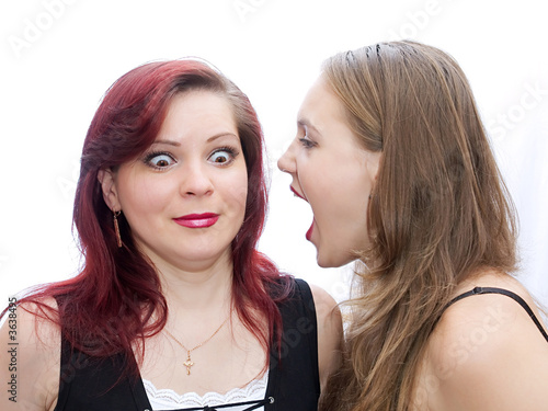 Two girls screaming to another