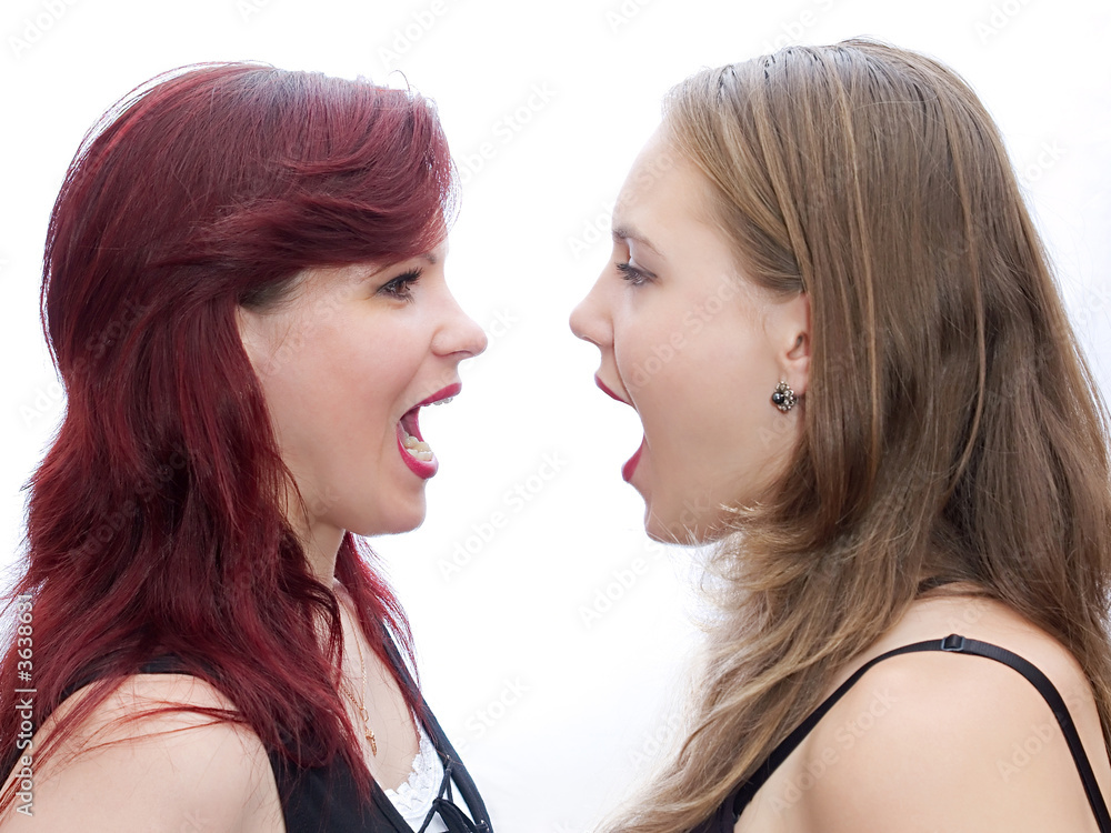 Two girls screaming to another Two girls screaming to another