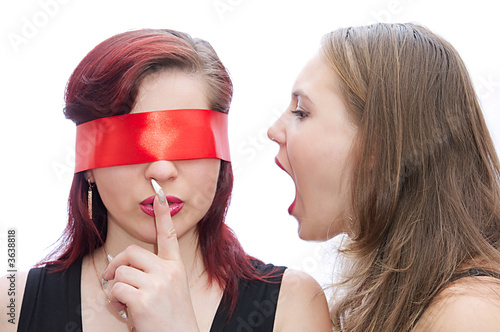 Two girls screaming to another