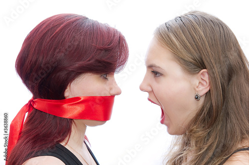 Two girls screaming to another