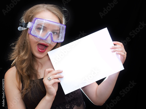 Girl in mask hold a sheet of paper
