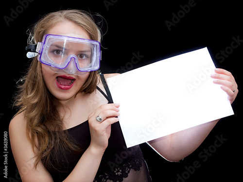 Girl in mask hold a sheet of paper