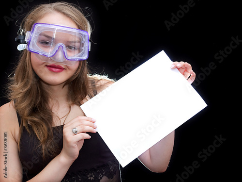Girl in mask hold a sheet of paper