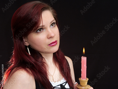 Girl and burning candle