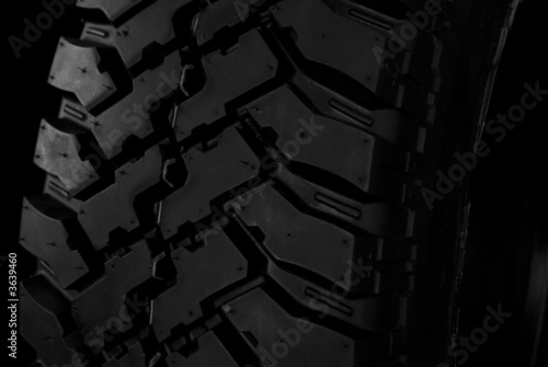 Black automotive tire close-up