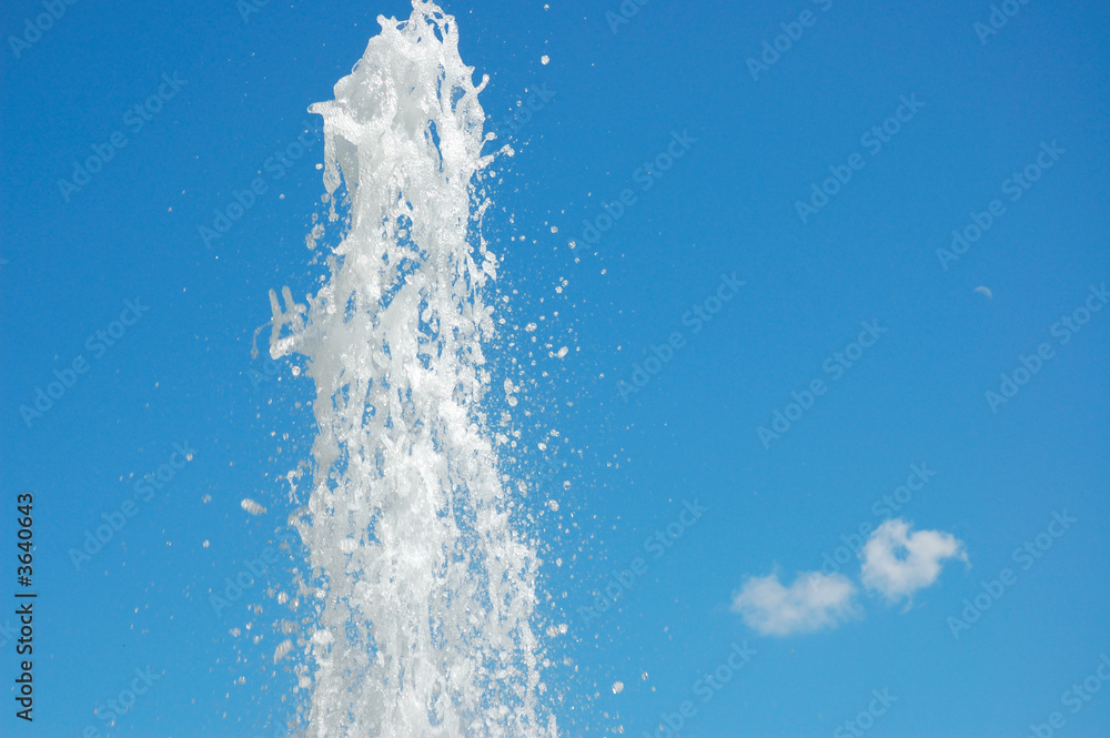 Fountain of water on a background blue sky Fountain of water on a background blue sky