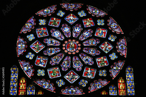 Rose stained glass window in Chartres, France photo