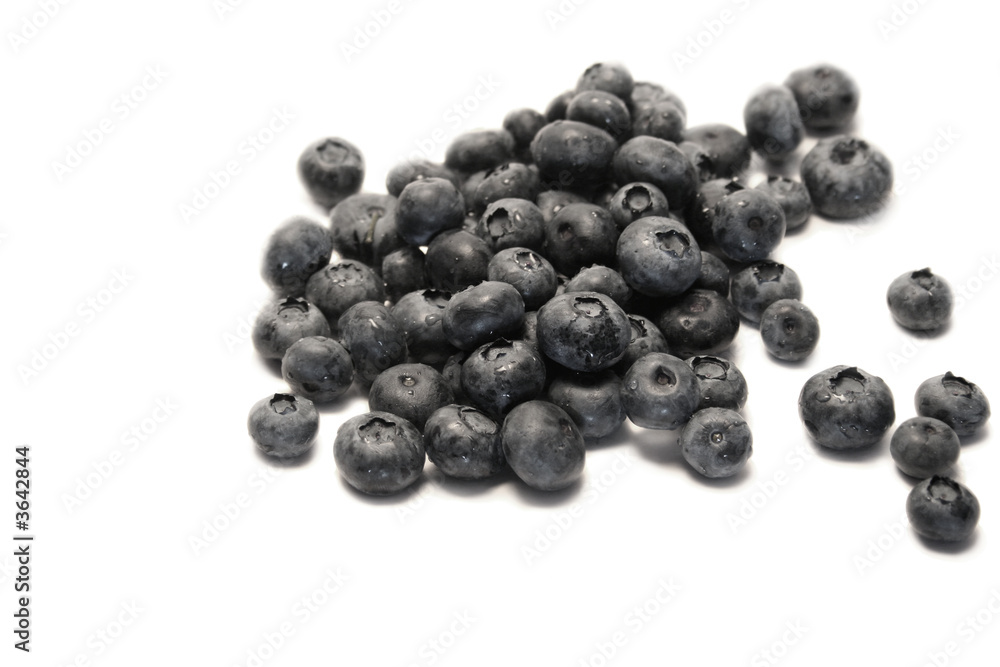 View of a pile of blueberries isolated over white View of a pile of blueberries isolated over white