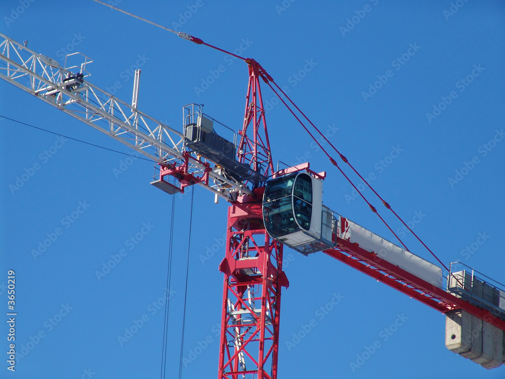 A construction crane over a blue sky A construction crane over a blue sky
