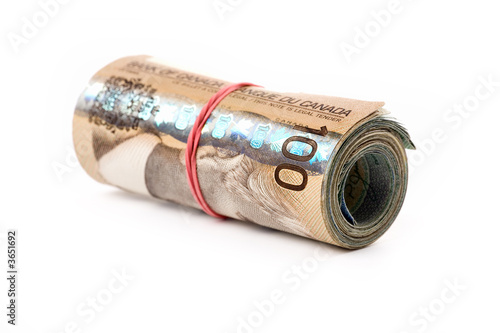 Konstfotografi a roll of canadian dollars with white background