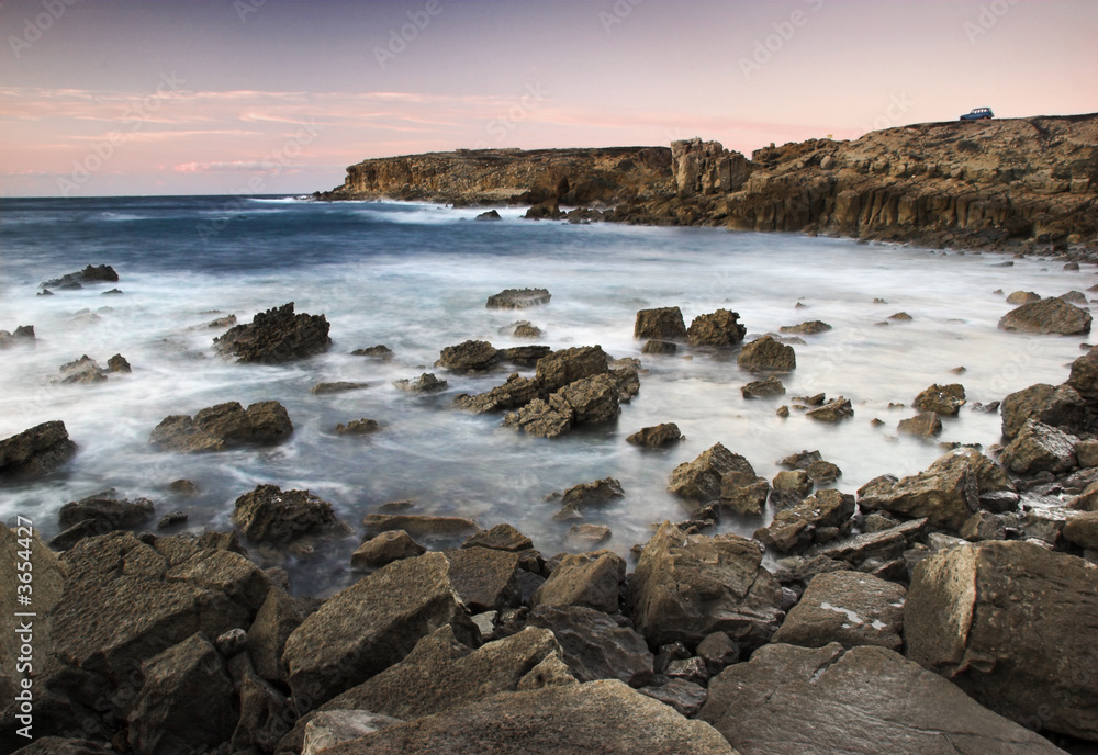 Picture of the sunset with beautiful rocks on the ocean