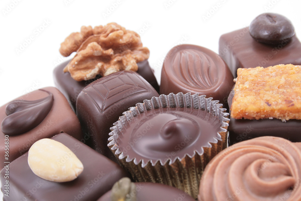 close-ups of mixed chocolates isolated on white close-ups of mixed chocolates isolated on white