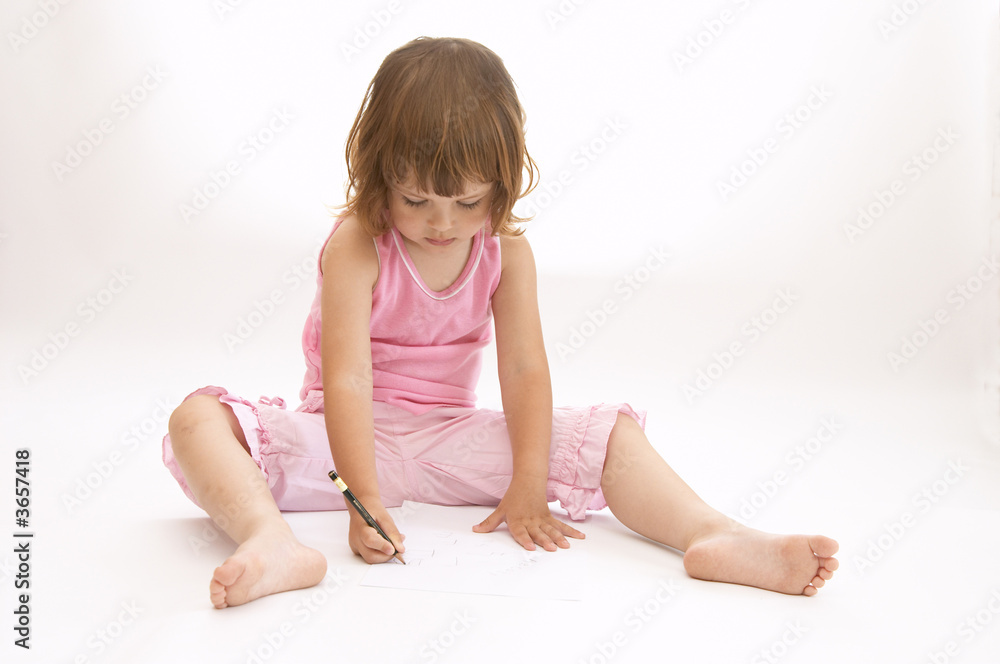 little, cute girl drawing on big white sheet of paper little, cute girl drawing on big white sheet of paper