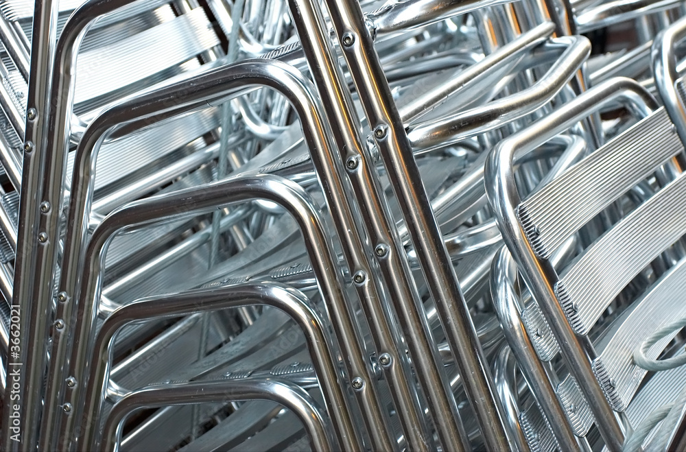 heap of metallic chairs heap of metallic chairs
