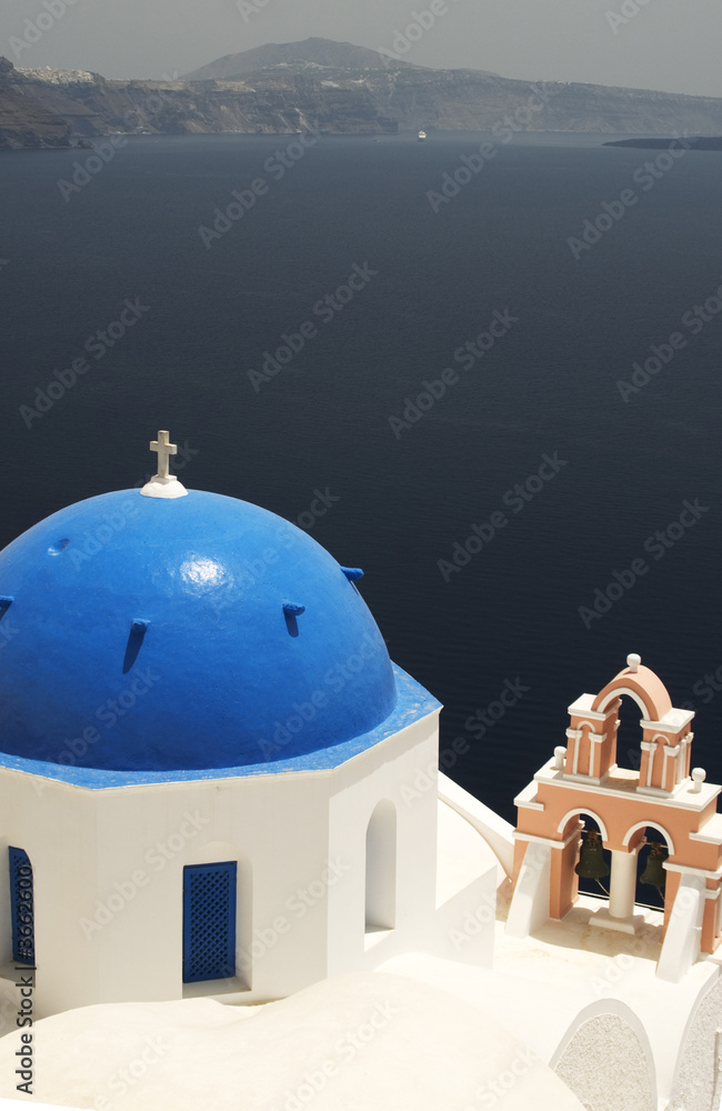 famous greek island church over aegean cruise ship in distance