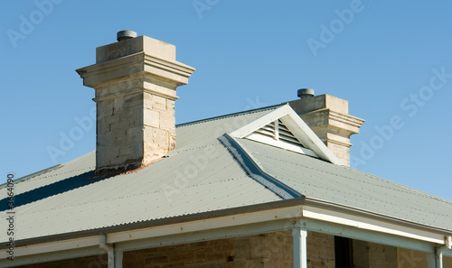 view of house roof line with view to blue sky