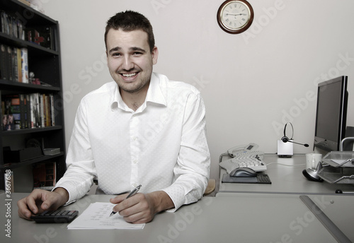 A businessman calculating expenses at tax time