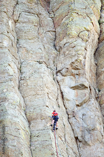 mountain climber on devil's tower, wyoming