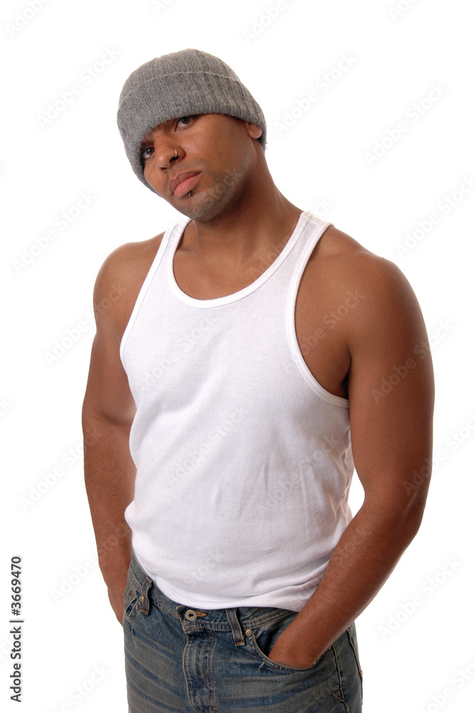 A handsome young man in a cap and a wife beater Stock Photo