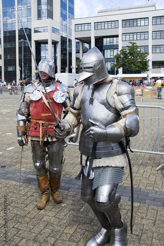 Two knights walking in a modern city