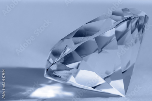 Close-up of shiny diamond. Shallow DOF. Space for text..