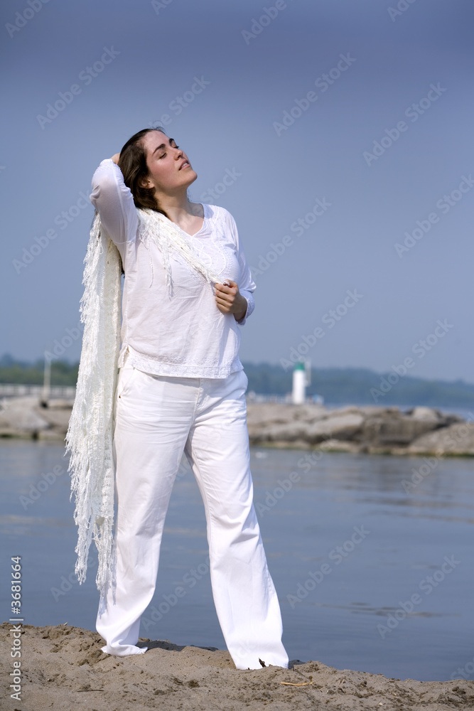 casual woman walking on the beach during summer days casual woman walking on the beach during summer days