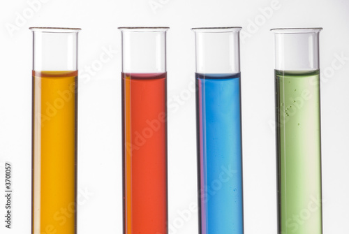 glass test tubes filled with colorful liquids
