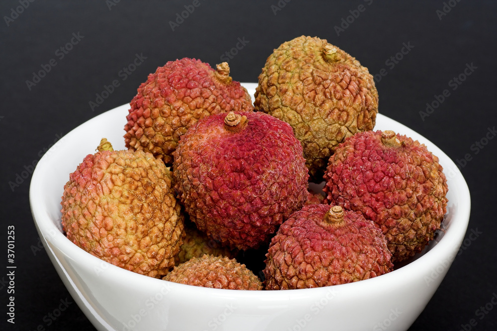 Bowl of Fresh Lychees on a Black Background