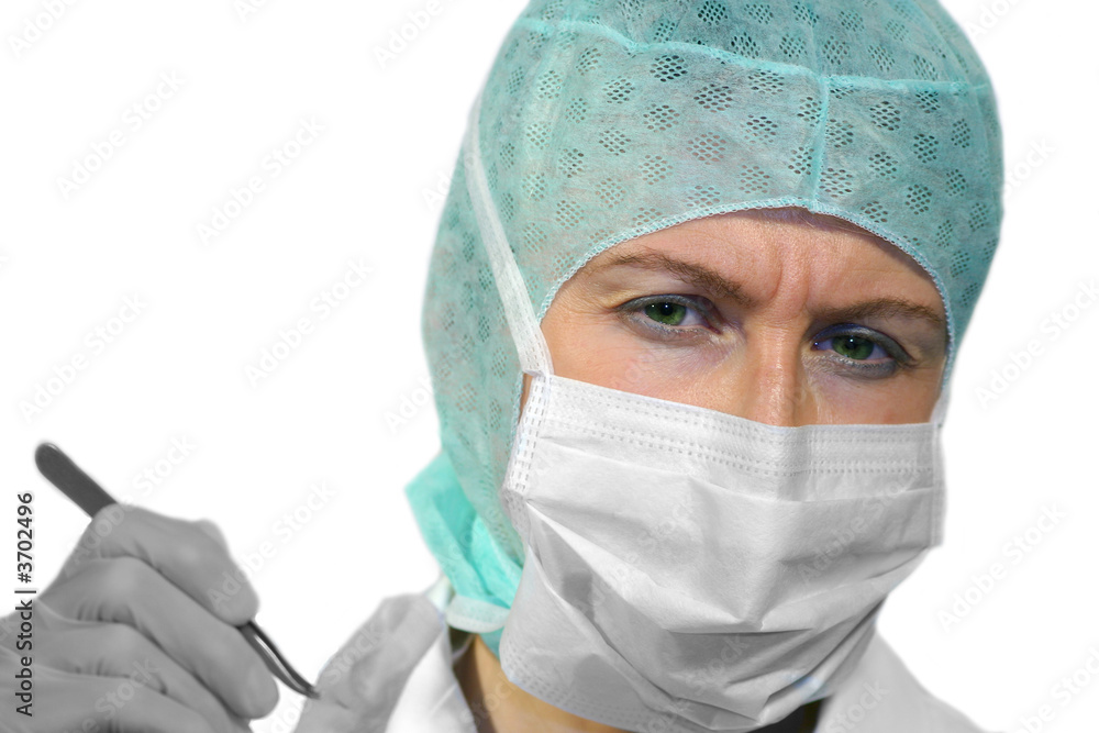Pretty doctor wearing sterile mask and head cover