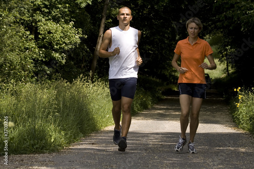 running people on the forest road