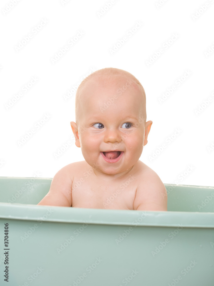 A small baby in the bath, isolated on white A small baby in the bath, isolated on white