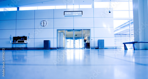 Airport Exit with clock and phones