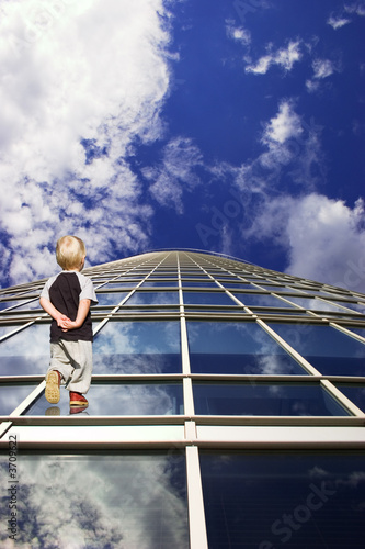 Child and his path to future. Perspective of skyscraper windows