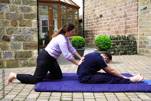 Flexing the spine as part of a Thai body massage.