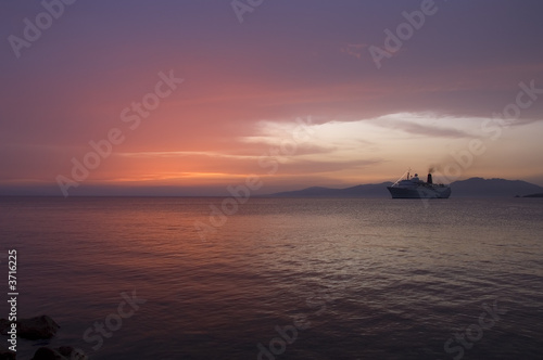 Sunset over Cruise boat at night, Aegean sea, Greece © Pierrette Guertin