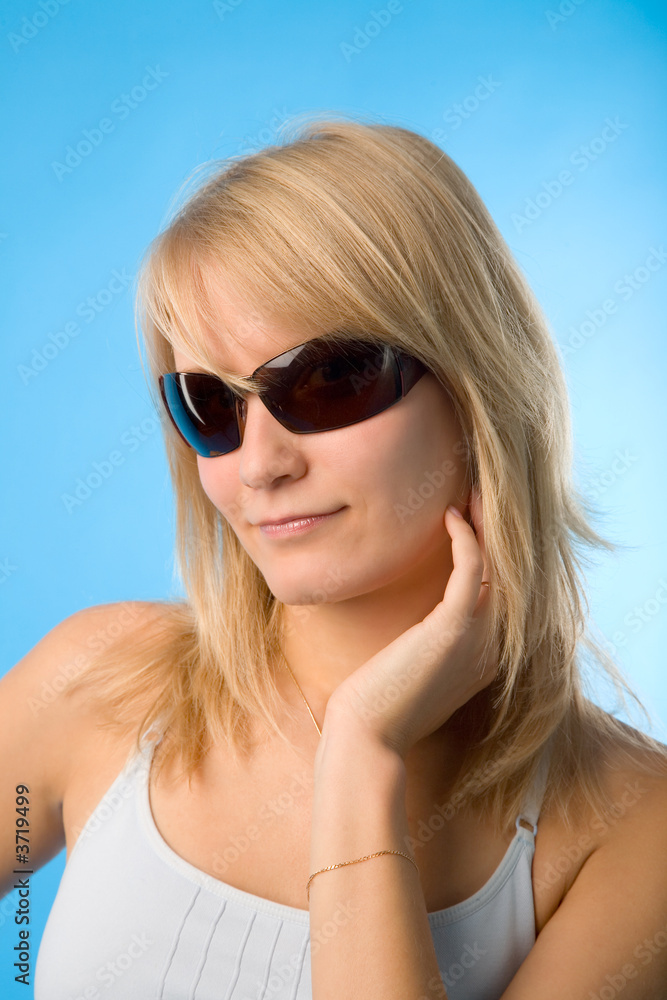 the portrait of young woman on blue background