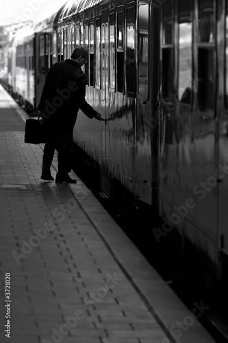 A train passenger boarding a train