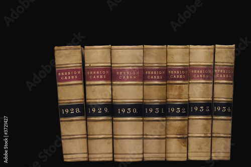 Spines of law reports against a black background