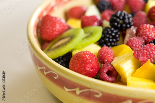 Delicious fruit salad in a bowl with strawberries and kiwi