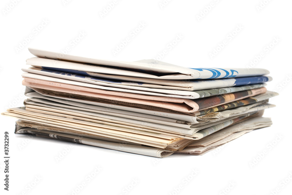 A stack of local newspapers with focus on front. Shallow DOF A stack of local newspapers with focus on front. Shallow DOF
