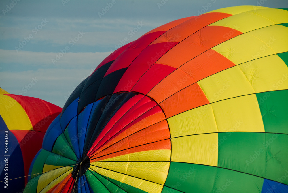 Fototapeta premium Colorful Hot Air Balloons being filled and inflated for flight