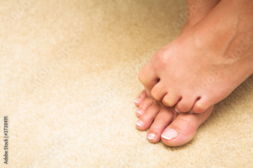 Feet and toes of a young adult woman photo