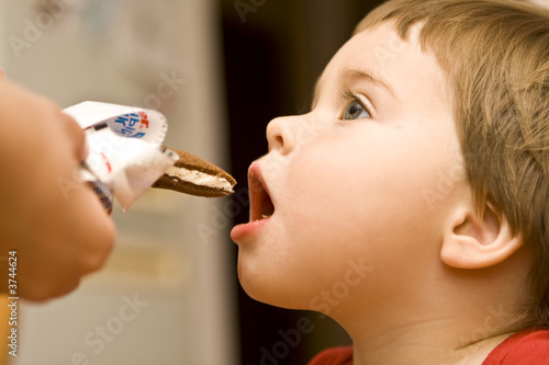 Baby biting a candy bar