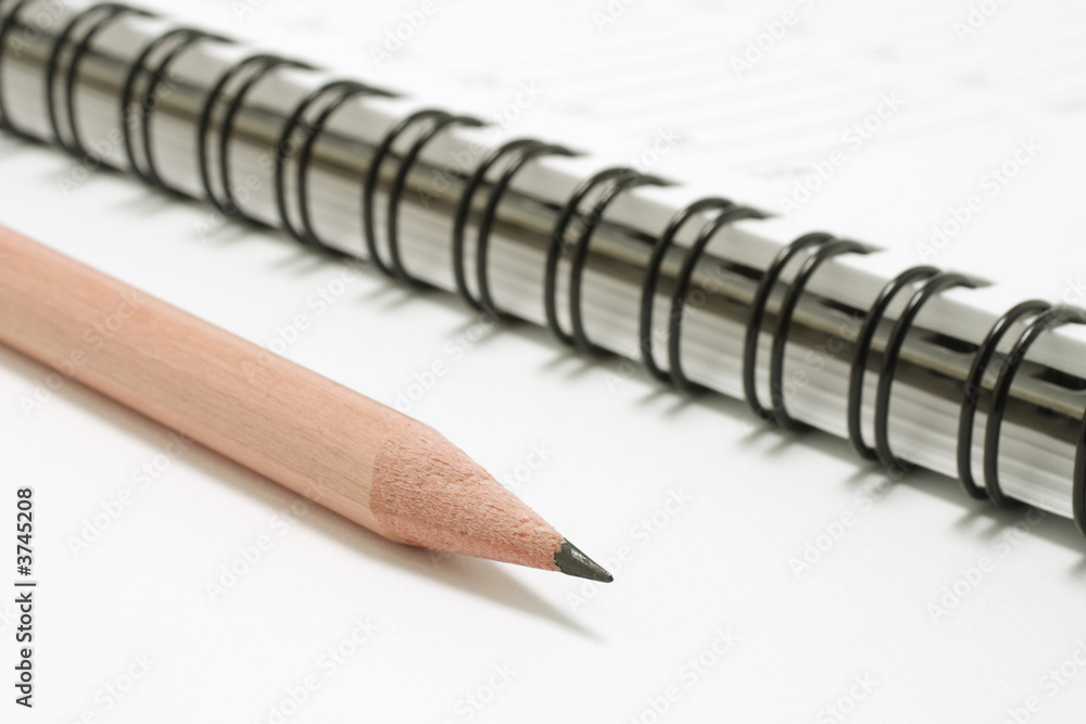 Closeup of a Pencil on a Pocket Planner Closeup of a Pencil on a Pocket Planner