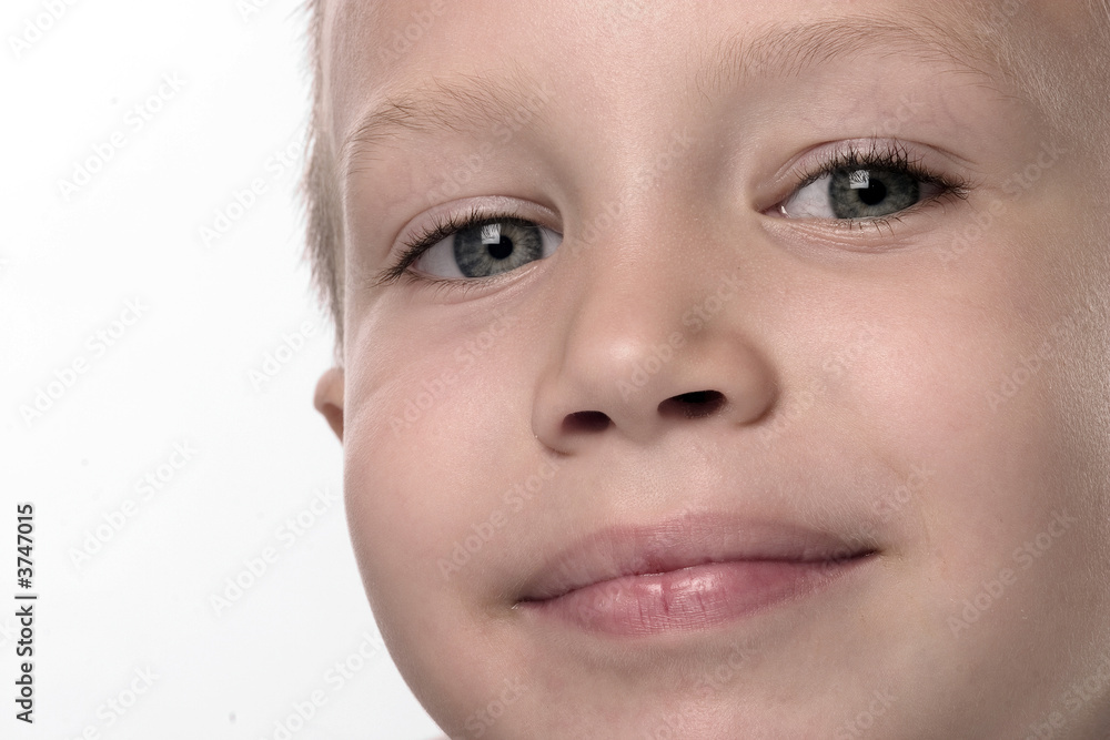 portrait of a smiling boy with blue eyes