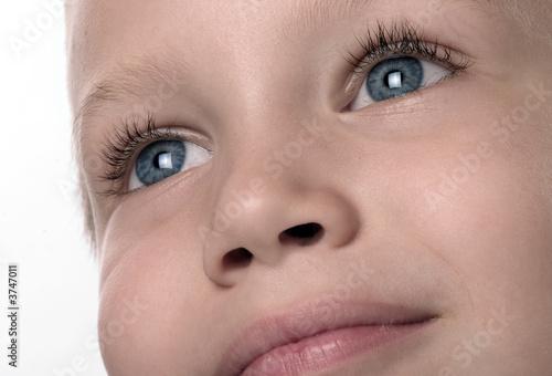 a face shot of a boy with smile