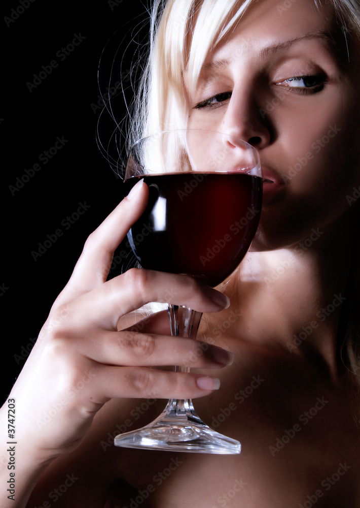 girl is looking beside and drinking wine girl is looking beside and drinking wine