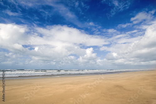 Sunny beach blue sky and golden sand